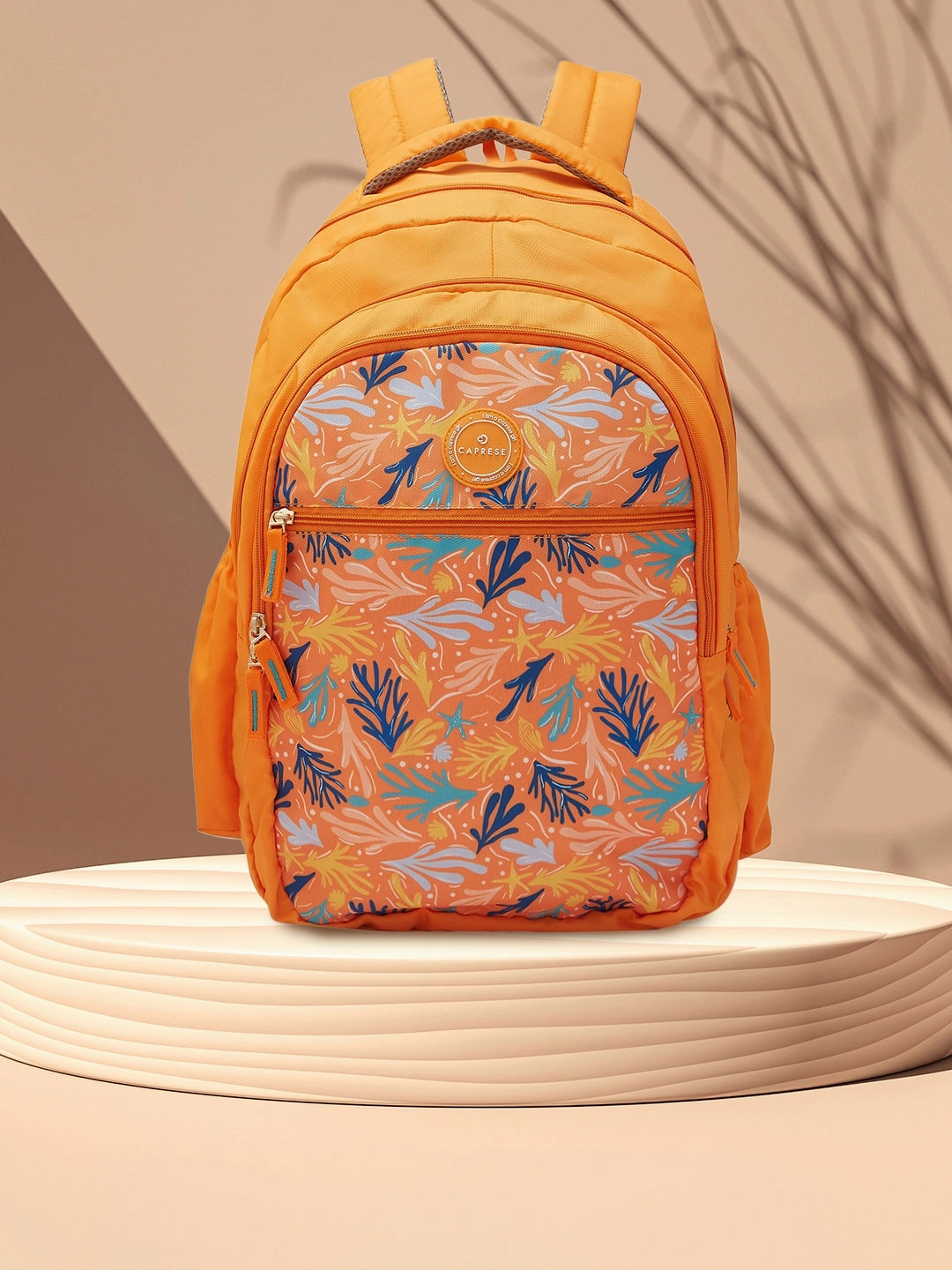 Caprese Xenia Large Printed Orange Laptop Backpack